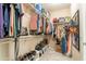 This walk-in closet features extensive shelving and hanging storage for an organized wardrobe at 11003 E Ravenna Cir, Mesa, AZ 85212