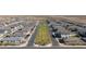 Long aerial photo of a common green space in a well planned new neighborhood with walking paths at 11444 E Utopia Ave, Mesa, AZ 85212