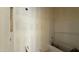 Unfinished bathroom showing the tub with tile surround at 11444 E Utopia Ave, Mesa, AZ 85212