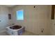Bathroom with a large window showing the tub and connections at 11444 E Utopia Ave, Mesa, AZ 85212
