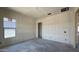 A bedroom under construction features fresh drywall, a window with view, and rough-in electrical outlets at 11444 E Utopia Ave, Mesa, AZ 85212