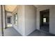 The entryway showcases a textured wall finish, a large window, and an open view into the home's interior spaces at 11444 E Utopia Ave, Mesa, AZ 85212