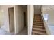 Hallway under construction shows drywall, stairwell, and an open floorplan to other rooms at 11444 E Utopia Ave, Mesa, AZ 85212