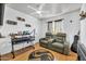 Relaxing bedroom with movie seats, a ceiling fan, a window, and a desk space at 12709 N El Frio St, El Mirage, AZ 85335