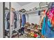 Organized walk-in closet with ample storage for clothing and accessories at 12709 N El Frio St, El Mirage, AZ 85335