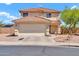 Charming two-story home featuring a tiled roof, a two-car garage, and low-maintenance desert landscaping at 12709 N El Frio St, El Mirage, AZ 85335