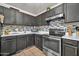 Well-equipped kitchen featuring stainless steel appliances and ample storage at 12709 N El Frio St, El Mirage, AZ 85335