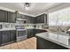 Beautiful kitchen with stainless steel appliances, marble countertop, and tiled backsplash at 12709 N El Frio St, El Mirage, AZ 85335