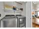 Convenient laundry room featuring new stainless steel washer and dryer units at 12709 N El Frio St, El Mirage, AZ 85335