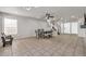 Spacious living room featuring dining area, tile floors, and staircase at 12709 N El Frio St, El Mirage, AZ 85335