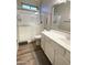 Bathroom featuring a glass-enclosed shower, modern vanity with sink, and stylish fixtures in a neutral color palette at 12753 W Vista Paseo Dr, Litchfield Park, AZ 85340