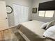 Bedroom featuring a comfortable bed, window with blinds, closet, and light walls for a bright, welcoming space at 12753 W Vista Paseo Dr, Litchfield Park, AZ 85340