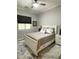 Bedroom with a white bed frame, a window for natural light, and soft, neutral tones for a calming atmosphere at 12753 W Vista Paseo Dr, Litchfield Park, AZ 85340