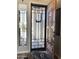 Elegant front door with a security screen, sidelight window, and neutral interior paint at 12753 W Vista Paseo Dr, Litchfield Park, AZ 85340