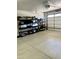 A well-organized garage featuring ample shelving and a clean, epoxy-coated floor at 12753 W Vista Paseo Dr, Litchfield Park, AZ 85340