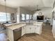View of the open-concept kitchen and living area featuring an island and modern decor at 12753 W Vista Paseo Dr, Litchfield Park, AZ 85340