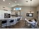 Bright kitchen featuring a large island with seating, stainless steel appliances, and ample cabinet space at 12753 W Vista Paseo Dr, Litchfield Park, AZ 85340