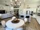 Open-concept kitchen with stainless appliances, island seating, flowing into the adjacent living and dining areas at 12753 W Vista Paseo Dr, Litchfield Park, AZ 85340