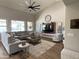 Spacious living room offers a stylish seating arrangement and plenty of natural light at 12753 W Vista Paseo Dr, Litchfield Park, AZ 85340