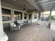 A covered patio with wicker furniture and ceiling fan at 12753 W Vista Paseo Dr, Litchfield Park, AZ 85340