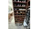 Walk-in closet with shoe storage, cabinets, hanging racks, drawers and a decorative rug at 12753 W Vista Paseo Dr, Litchfield Park, AZ 85340