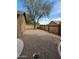 Low maintenance backyard with gravel and mature tree at 1333 E Cecil Ct, Casa Grande, AZ 85122