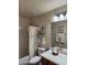 Well-lit bathroom featuring a combined shower-tub and charming decor at 1333 E Cecil Ct, Casa Grande, AZ 85122