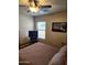 Comfortable bedroom with ceiling fan and natural light at 1333 E Cecil Ct, Casa Grande, AZ 85122