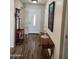 Attractive entryway featuring hardwood floors, coat rack, and decorative table at 1333 E Cecil Ct, Casa Grande, AZ 85122