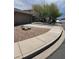 Well-maintained home exterior featuring a paved driveway, gravel landscaping, and a neatly trimmed lawn at 1333 E Cecil Ct, Casa Grande, AZ 85122