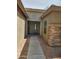 Inviting front entrance features a covered porch and stone accents at 1333 E Cecil Ct, Casa Grande, AZ 85122