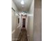Well-lit hallway with laminate flooring at 1333 E Cecil Ct, Casa Grande, AZ 85122
