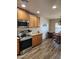 Bright kitchen featuring stainless steel appliances and wooden cabinets at 1333 E Cecil Ct, Casa Grande, AZ 85122