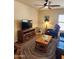 Inviting living room with a wooden coffee table and entertainment center at 1333 E Cecil Ct, Casa Grande, AZ 85122