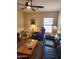 Comfortable living room featuring a ceiling fan, and a cozy seating area at 1333 E Cecil Ct, Casa Grande, AZ 85122