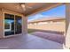 Covered patio featuring red brick pavers and sliding glass door at 13523 W Remuda Dr, Peoria, AZ 85383