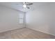 Bedroom with neutral carpet, ceiling fan, and a single window at 13523 W Remuda Dr, Peoria, AZ 85383
