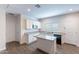 Bright kitchen features white cabinets, granite countertops, and stainless steel microwave at 13523 W Remuda Dr, Peoria, AZ 85383