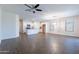 Spacious open-concept living room connecting to the kitchen with tiled floors and natural light at 13523 W Remuda Dr, Peoria, AZ 85383