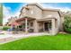Spacious backyard showcasing a covered patio perfect for lounging and manicured artificial grass at 13566 N 93Rd Pl, Scottsdale, AZ 85260
