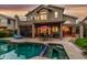 Home exterior featuring a pool, spa, and covered patio, with outdoor seating, on a well-maintained backyard at 13566 N 93Rd Pl, Scottsdale, AZ 85260