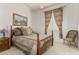 This is a lovely primary bedroom features a four-post bed, neutral carpet and a scenic framed print at 13566 N 93Rd Pl, Scottsdale, AZ 85260