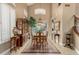 Elegant dining room showcasing a high ceiling, traditional furniture, and outdoor views at 13566 N 93Rd Pl, Scottsdale, AZ 85260