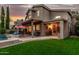 Two-story home exterior showcasing a covered patio, a pool and spa, outdoor seating, and landscaped backyard at 13566 N 93Rd Pl, Scottsdale, AZ 85260