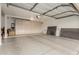 The large garage features custom cabinets, epoxy flooring and plenty of room for storage at 13566 N 93Rd Pl, Scottsdale, AZ 85260