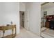 A hallway leading to an office space features neutral walls and carpet at 13566 N 93Rd Pl, Scottsdale, AZ 85260