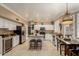 Open kitchen boasting white cabinets, stainless steel appliances, an island and breakfast nook at 13566 N 93Rd Pl, Scottsdale, AZ 85260