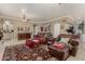 Comfortable living room with a fireplace, plush seating, and classic rug at 13566 N 93Rd Pl, Scottsdale, AZ 85260