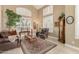 Spacious living room featuring high ceilings, neutral tones, and elegant decor at 13566 N 93Rd Pl, Scottsdale, AZ 85260
