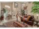 Inviting living room featuring a staircase, plush seating, and elegant decor in a spacious layout at 13566 N 93Rd Pl, Scottsdale, AZ 85260